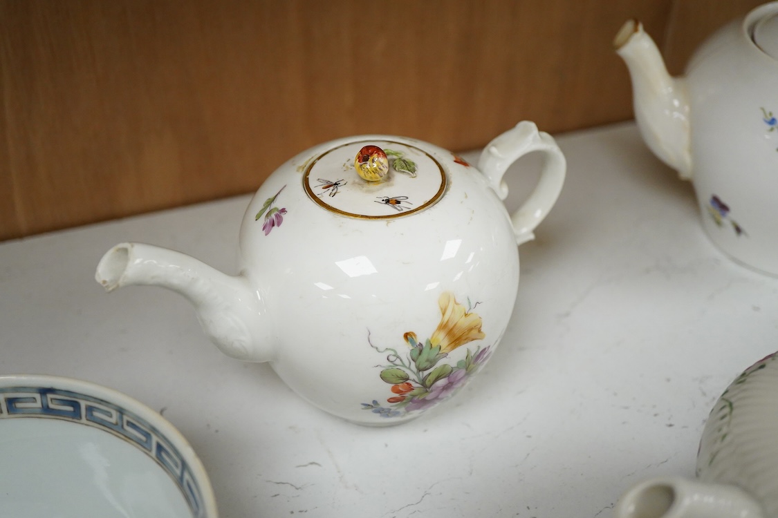 An 18th Furstenburg porcelain teapot and cover, a Wallendorf porcelain teapot and cover and a Meissen style teapot, 12cm high